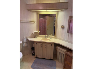 This lovely, manufactured home on leased land in a gated and age on Pine Lakes Country Club in Florida - for sale on GolfHomes.com, golf home, golf lot