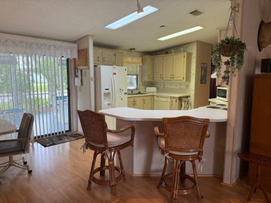 This lovely, manufactured home on leased land in a gated and age on Pine Lakes Country Club in Florida - for sale on GolfHomes.com, golf home, golf lot