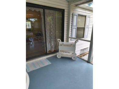 This lovely, manufactured home on leased land in a gated and age on Pine Lakes Country Club in Florida - for sale on GolfHomes.com, golf home, golf lot