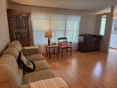 This lovely, manufactured home on leased land in a gated and age on Pine Lakes Country Club in Florida - for sale on GolfHomes.com, golf home, golf lot