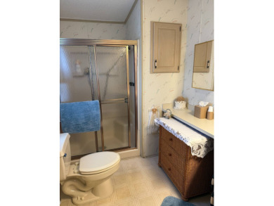 This lovely, manufactured home on leased land in a gated and age on Pine Lakes Country Club in Florida - for sale on GolfHomes.com, golf home, golf lot