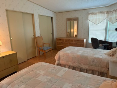 This lovely, manufactured home on leased land in a gated and age on Pine Lakes Country Club in Florida - for sale on GolfHomes.com, golf home, golf lot