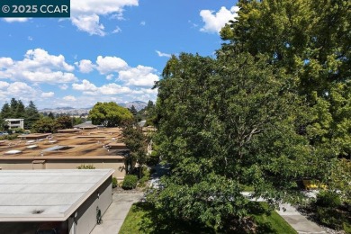 This bright and cheerful Sequoia Wrap end-unit is like a tree on Rossmoor Golf Course in California - for sale on GolfHomes.com, golf home, golf lot