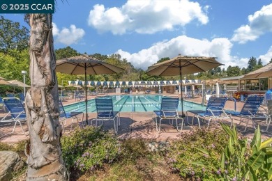 This bright and cheerful Sequoia Wrap end-unit is like a tree on Rossmoor Golf Course in California - for sale on GolfHomes.com, golf home, golf lot
