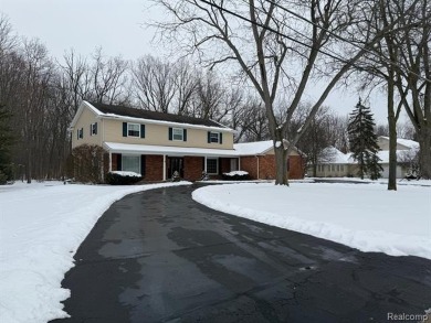 This beautiful brick home in Warwick Hills Golf Community offers on Warwick Hills Golf and Country Club in Michigan - for sale on GolfHomes.com, golf home, golf lot