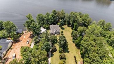 Discover the perfect blend of elegance, functionality, and on River Golf and County Club at Lake Royale in North Carolina - for sale on GolfHomes.com, golf home, golf lot