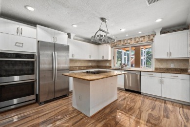 Tucked away on a serene half acre canal front homesite inside on Meadowood Golf and Tennis Club in Florida - for sale on GolfHomes.com, golf home, golf lot