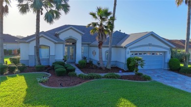 Sought after lake views  in Tamarron. Great curb appeal on Eagle Ridge At Spruce Creek Country Club in Florida - for sale on GolfHomes.com, golf home, golf lot