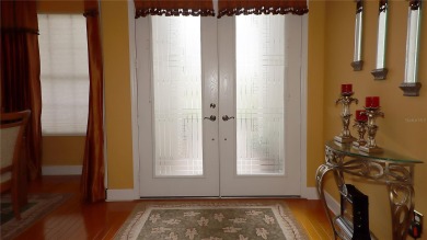 Sought after lake views  in Tamarron. Great curb appeal on Eagle Ridge At Spruce Creek Country Club in Florida - for sale on GolfHomes.com, golf home, golf lot