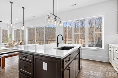 Experience modern elegance and breathtaking golf course views in on Verdict Ridge Golf and Country Club in North Carolina - for sale on GolfHomes.com, golf home, golf lot