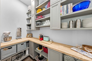 Experience modern elegance and breathtaking golf course views in on Verdict Ridge Golf and Country Club in North Carolina - for sale on GolfHomes.com, golf home, golf lot