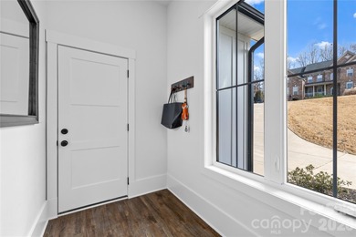 Experience modern elegance and breathtaking golf course views in on Verdict Ridge Golf and Country Club in North Carolina - for sale on GolfHomes.com, golf home, golf lot