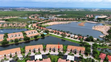 Step into this inviting and pristine first floor waterfront home on Colonial Country Club in Florida - for sale on GolfHomes.com, golf home, golf lot