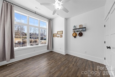 Experience modern elegance and breathtaking golf course views in on Verdict Ridge Golf and Country Club in North Carolina - for sale on GolfHomes.com, golf home, golf lot