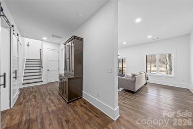 Experience modern elegance and breathtaking golf course views in on Verdict Ridge Golf and Country Club in North Carolina - for sale on GolfHomes.com, golf home, golf lot