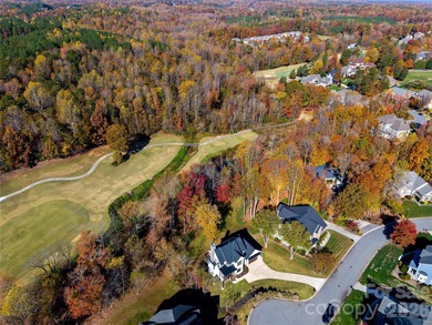 Experience modern elegance and breathtaking golf course views in on Verdict Ridge Golf and Country Club in North Carolina - for sale on GolfHomes.com, golf home, golf lot