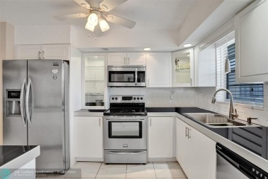 Move-in ready 2 bedroom condo in gated senior complex. Located on Inverrary Country Club in Florida - for sale on GolfHomes.com, golf home, golf lot