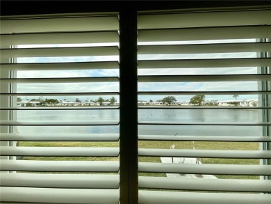 Beautiful waterview at this stunning 2 bedroom, 2 bath, 2 car on Mainlands Golf Club in Florida - for sale on GolfHomes.com, golf home, golf lot