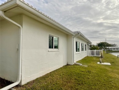 Beautiful waterview at this stunning 2 bedroom, 2 bath, 2 car on Mainlands Golf Club in Florida - for sale on GolfHomes.com, golf home, golf lot