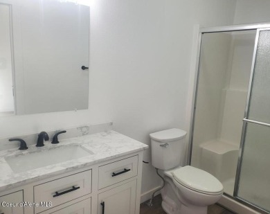 Charming 2-bedroom, 2-bath cottage nestled in a peaceful on Sandpoint Elks Golf Course in Idaho - for sale on GolfHomes.com, golf home, golf lot