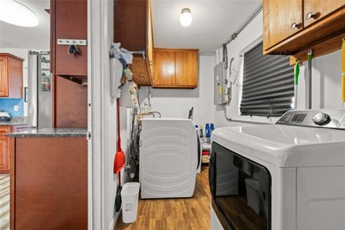 Located in Mainlands of Tamarac by the Gulf, this updated on Mainlands Golf Club in Florida - for sale on GolfHomes.com, golf home, golf lot