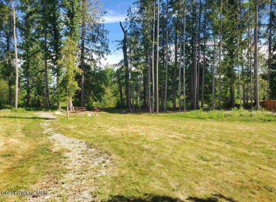 Charming 2-bedroom, 2-bath cottage nestled in a peaceful on Sandpoint Elks Golf Course in Idaho - for sale on GolfHomes.com, golf home, golf lot