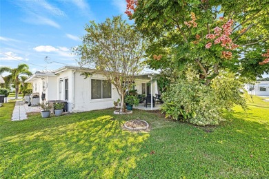 Located in Mainlands of Tamarac by the Gulf, this updated on Mainlands Golf Club in Florida - for sale on GolfHomes.com, golf home, golf lot