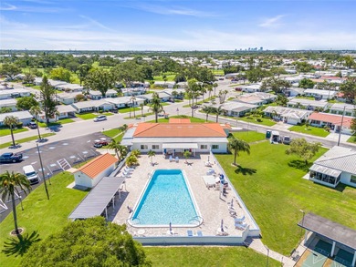 Located in Mainlands of Tamarac by the Gulf, this updated on Mainlands Golf Club in Florida - for sale on GolfHomes.com, golf home, golf lot