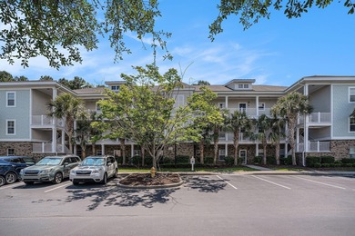 This first-floor end unit condominium features three bedrooms on Barefoot Resort and Golf Club  in South Carolina - for sale on GolfHomes.com, golf home, golf lot