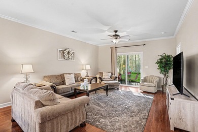 This first-floor end unit condominium features three bedrooms on Barefoot Resort and Golf Club  in South Carolina - for sale on GolfHomes.com, golf home, golf lot