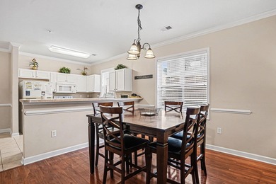 This first-floor end unit condominium features three bedrooms on Barefoot Resort and Golf Club  in South Carolina - for sale on GolfHomes.com, golf home, golf lot