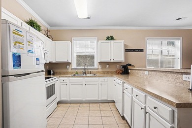This first-floor end unit condominium features three bedrooms on Barefoot Resort and Golf Club  in South Carolina - for sale on GolfHomes.com, golf home, golf lot