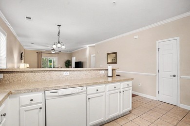 This first-floor end unit condominium features three bedrooms on Barefoot Resort and Golf Club  in South Carolina - for sale on GolfHomes.com, golf home, golf lot