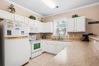 This first-floor end unit condominium features three bedrooms on Barefoot Resort and Golf Club  in South Carolina - for sale on GolfHomes.com, golf home, golf lot