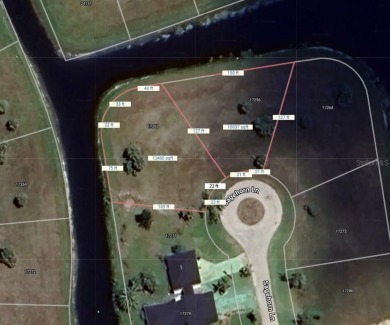 Beautiful waterfront tip lot with over 173 feet of shoreline on Burnt Store Golf Club in Florida - for sale on GolfHomes.com, golf home, golf lot