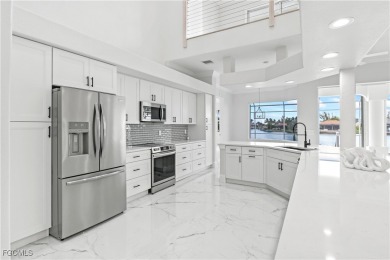 Welcome to your GULF ACCESS DREAM HOME! A commanding 4-bedroom on Palmetto-Pine Country Club in Florida - for sale on GolfHomes.com, golf home, golf lot