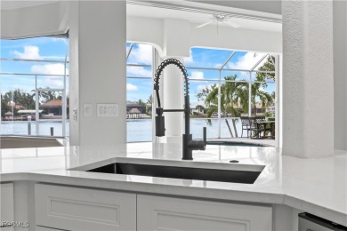 Welcome to your GULF ACCESS DREAM HOME! A commanding 4-bedroom on Palmetto-Pine Country Club in Florida - for sale on GolfHomes.com, golf home, golf lot