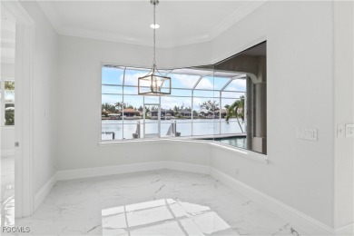 Welcome to your GULF ACCESS DREAM HOME! A commanding 4-bedroom on Palmetto-Pine Country Club in Florida - for sale on GolfHomes.com, golf home, golf lot
