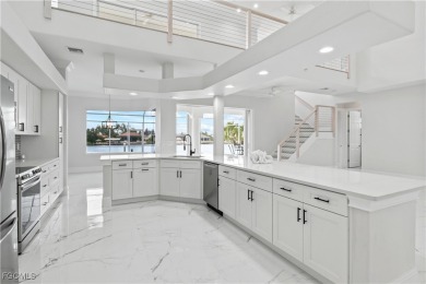Welcome to your GULF ACCESS DREAM HOME! A commanding 4-bedroom on Palmetto-Pine Country Club in Florida - for sale on GolfHomes.com, golf home, golf lot