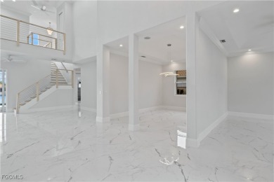 Welcome to your GULF ACCESS DREAM HOME! A commanding 4-bedroom on Palmetto-Pine Country Club in Florida - for sale on GolfHomes.com, golf home, golf lot