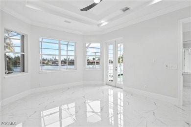 Welcome to your GULF ACCESS DREAM HOME! A commanding 4-bedroom on Palmetto-Pine Country Club in Florida - for sale on GolfHomes.com, golf home, golf lot