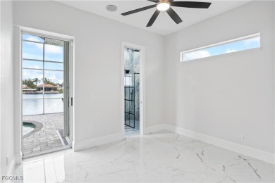 Welcome to your GULF ACCESS DREAM HOME! A commanding 4-bedroom on Palmetto-Pine Country Club in Florida - for sale on GolfHomes.com, golf home, golf lot