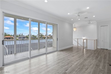 Welcome to your GULF ACCESS DREAM HOME! A commanding 4-bedroom on Palmetto-Pine Country Club in Florida - for sale on GolfHomes.com, golf home, golf lot