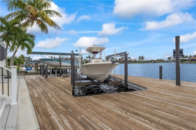 Welcome to your GULF ACCESS DREAM HOME! A commanding 4-bedroom on Palmetto-Pine Country Club in Florida - for sale on GolfHomes.com, golf home, golf lot