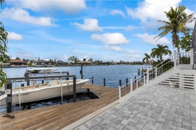 Welcome to your GULF ACCESS DREAM HOME! A commanding 4-bedroom on Palmetto-Pine Country Club in Florida - for sale on GolfHomes.com, golf home, golf lot
