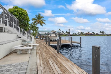 Welcome to your GULF ACCESS DREAM HOME! A commanding 4-bedroom on Palmetto-Pine Country Club in Florida - for sale on GolfHomes.com, golf home, golf lot