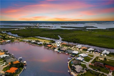 Welcome to your GULF ACCESS DREAM HOME! A commanding 4-bedroom on Palmetto-Pine Country Club in Florida - for sale on GolfHomes.com, golf home, golf lot