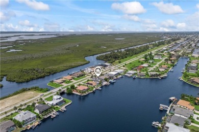 Welcome to your GULF ACCESS DREAM HOME! A commanding 4-bedroom on Palmetto-Pine Country Club in Florida - for sale on GolfHomes.com, golf home, golf lot