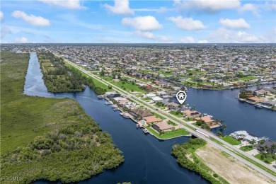 Welcome to your GULF ACCESS DREAM HOME! A commanding 4-bedroom on Palmetto-Pine Country Club in Florida - for sale on GolfHomes.com, golf home, golf lot