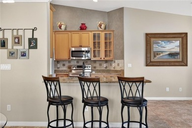 Effortlessly elegant and impeccably maintained, this on Glen Eagle Golf and Country Club in Florida - for sale on GolfHomes.com, golf home, golf lot